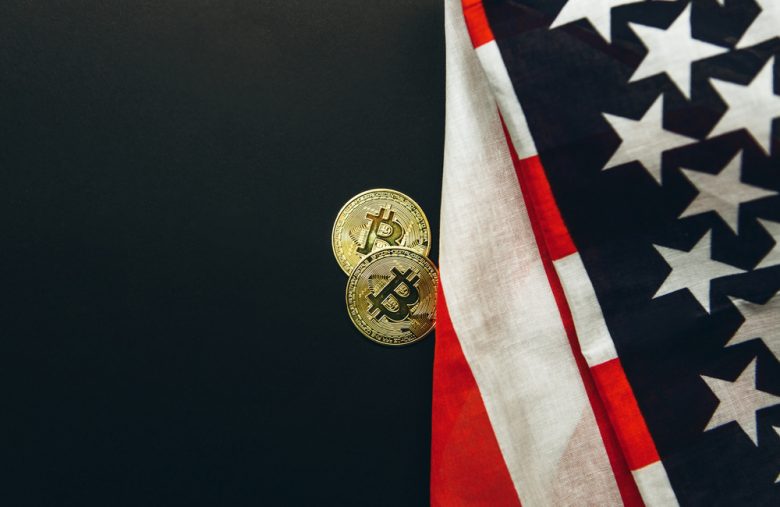Bitcoin,Cryptocurrency,Coins,Next,To,American,Flag,Background.