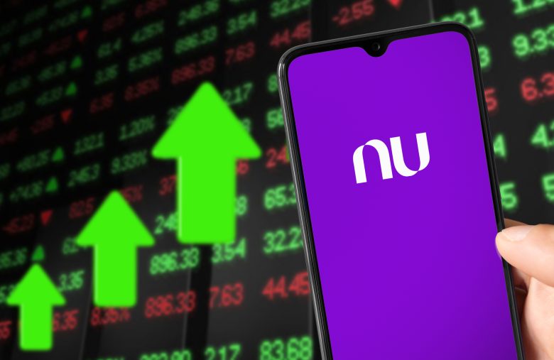 Smartphone with NuBank logo and background showing market value