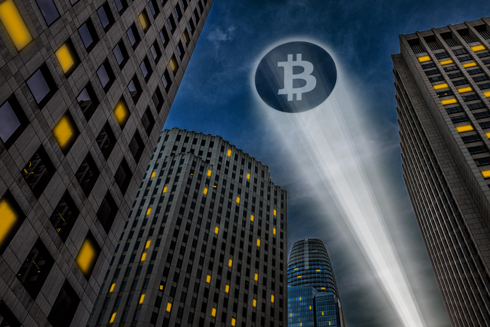 Bitcoin,Cryptocurrency,Logo,Projected,On,The,Sky,By,A,Beam