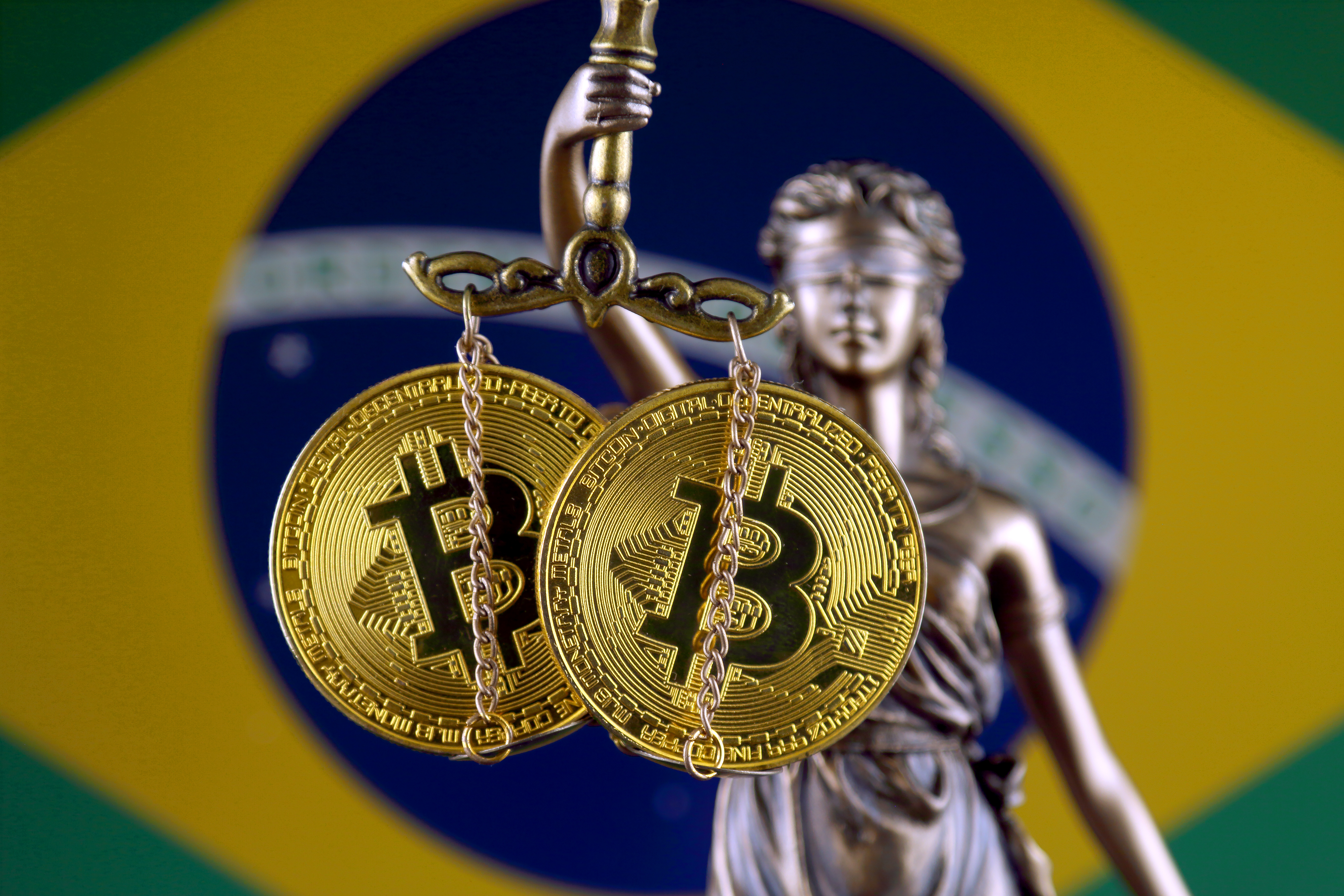 Symbol of law and justice, physical version of Bitcoin and Brazi