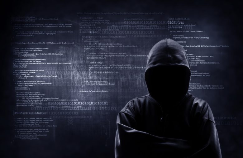 Internet crime concept. Hacker working on a code on dark digital Justin Sun