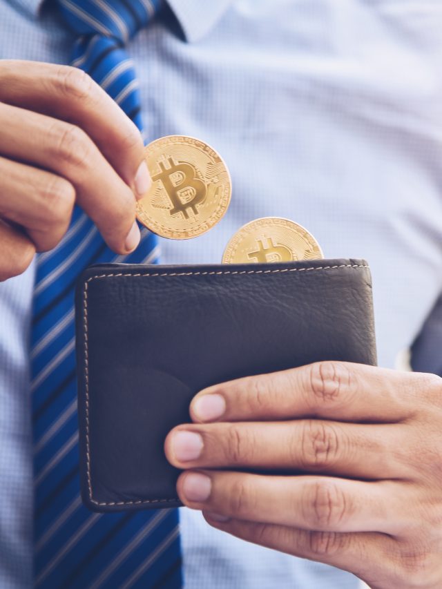 A businessman is taking a coin bit in a wallet.The concept of mo